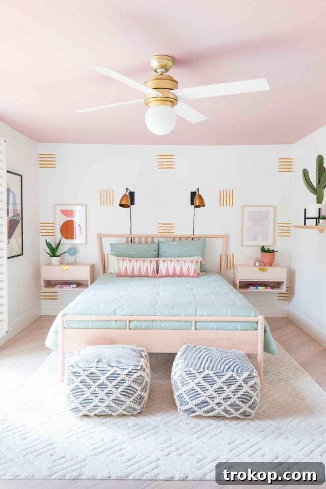 Overall view of the welcoming guest bedroom with a golden yellow accent wall and cozy decor.