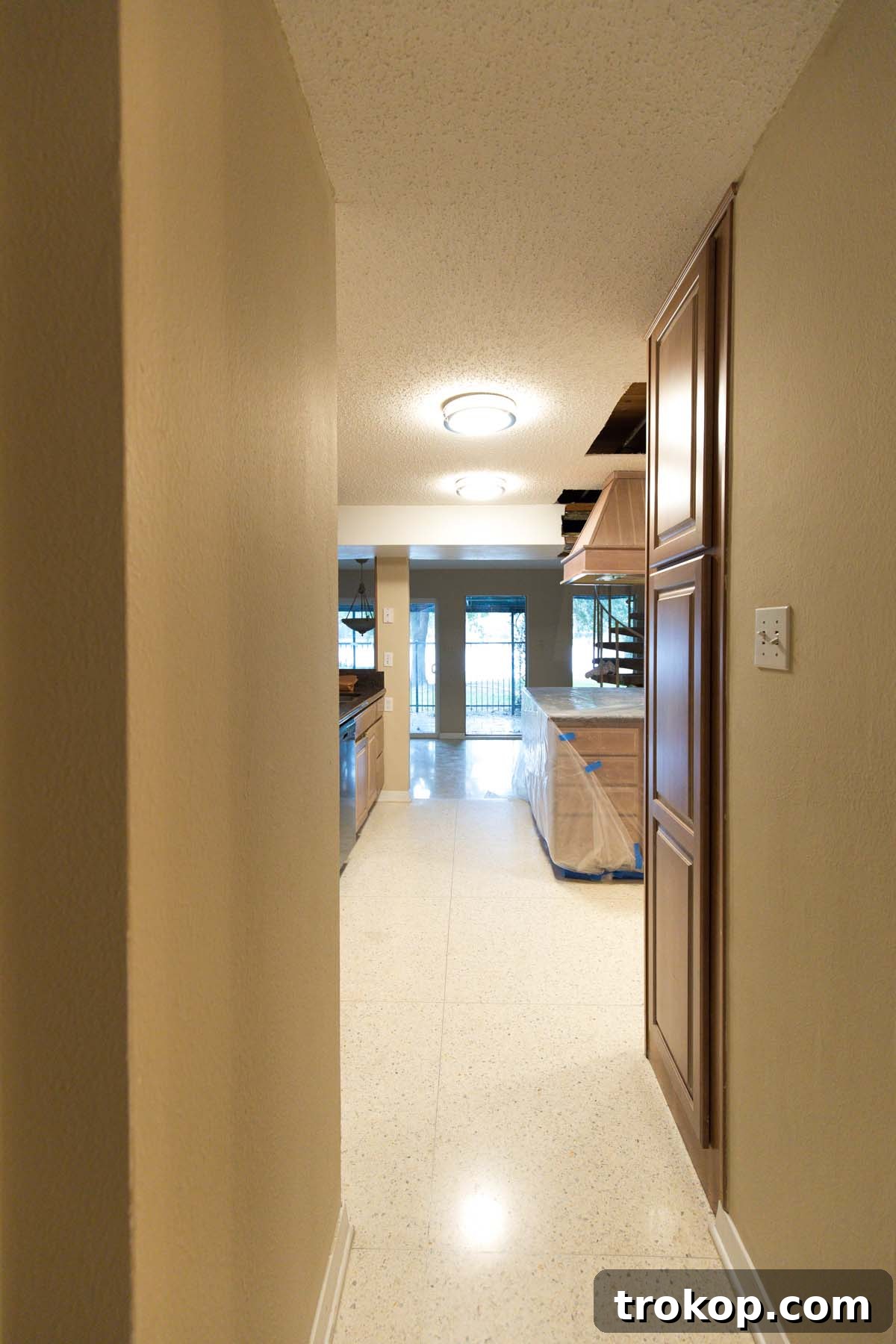Original laundry room before renovation, showcasing the potential for a versatile walkthrough pantry. A key element in optimizing home flow and storage for kitchen design projects.