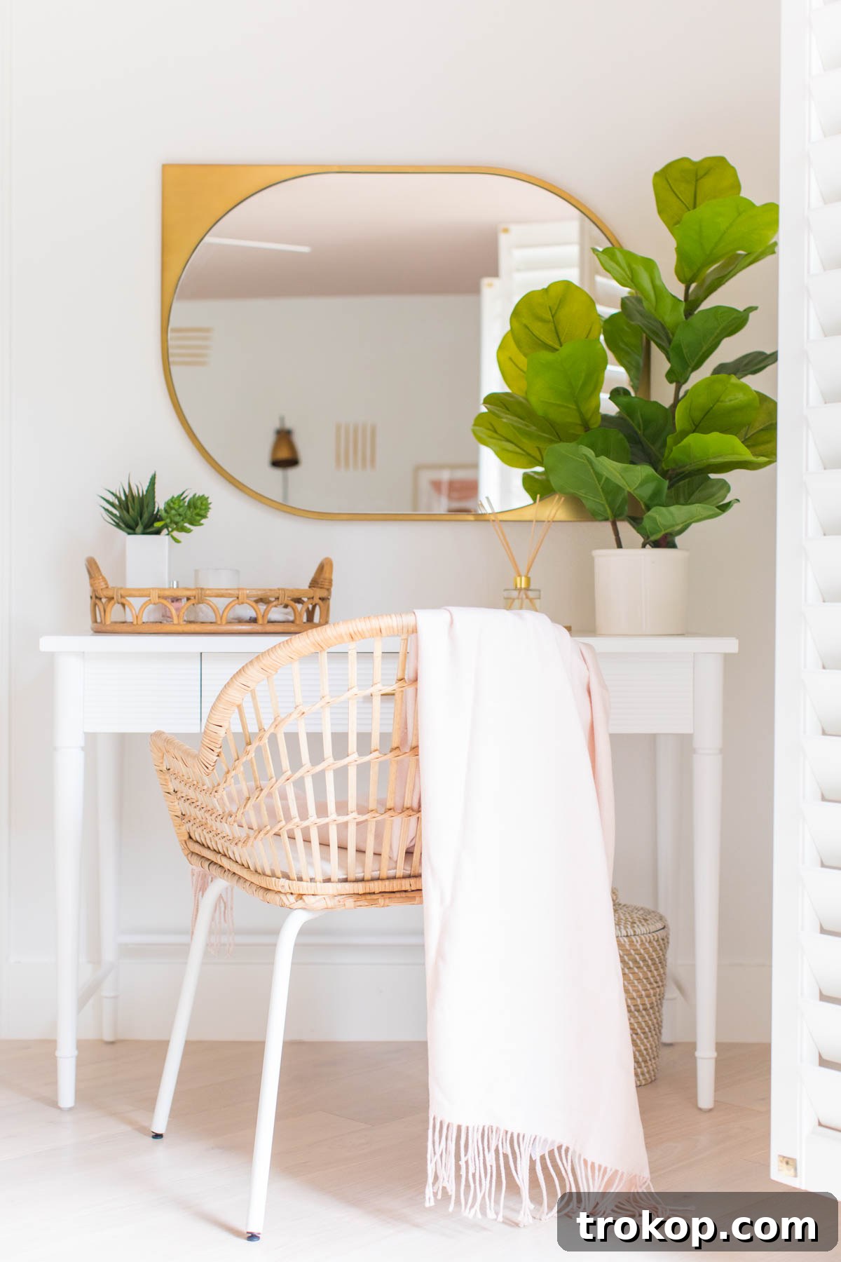 Woven Warmth: Embracing Cane and Rattan Decor 2 A stylish guest bedroom featuring an accent wall, a cane bed frame, and rattan decor, showcasing how natural materials enhance modern interior design.