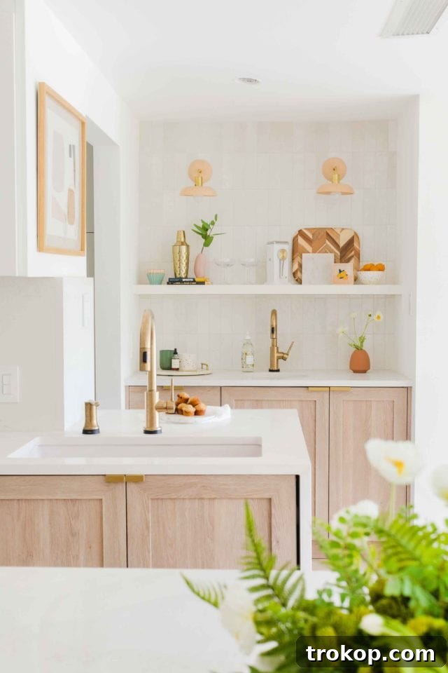 Concealed sliding door leading to an appliance closet