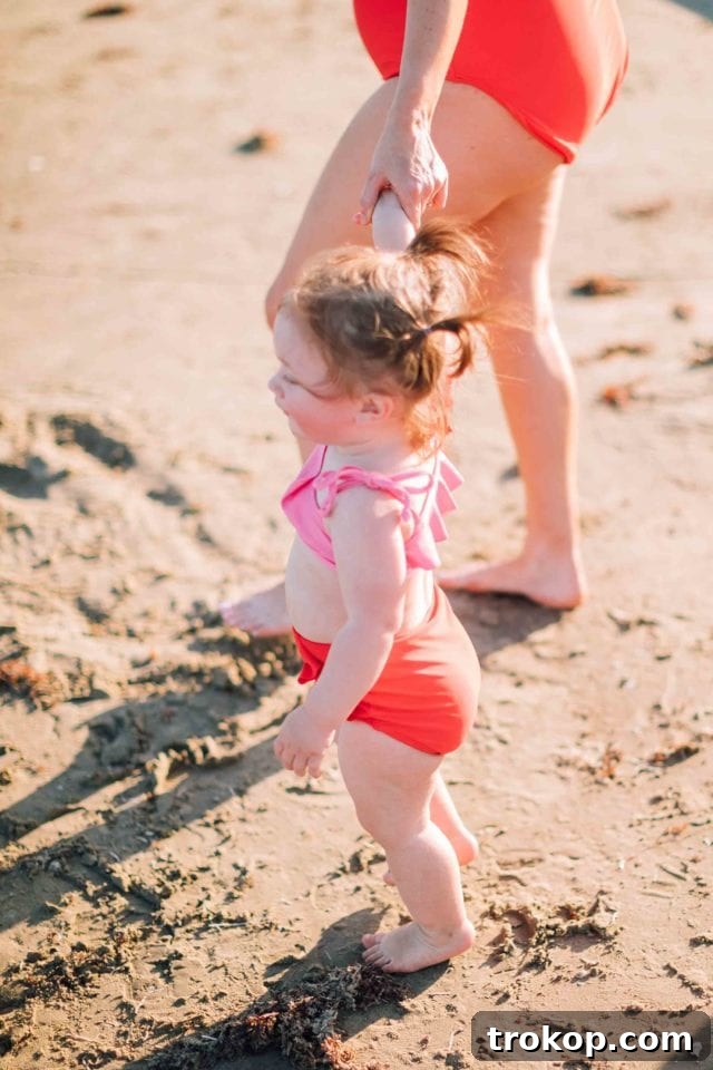 Close-up of Gwen in the confetti print rash guard, showing the details of the fabric and print, part of the Sugar & Cloth x Olivia + Ocean mommy and me collection.