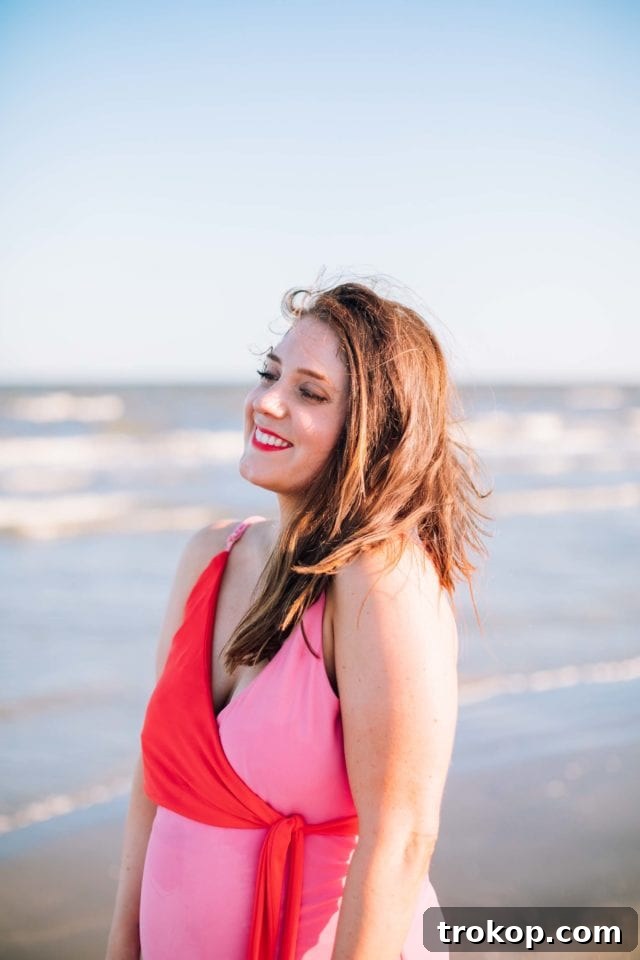 Full back view of Ashley Rose in the color block mom bod one-piece, highlighting the design details and comfortable coverage of the Olivia + Ocean swimsuit.