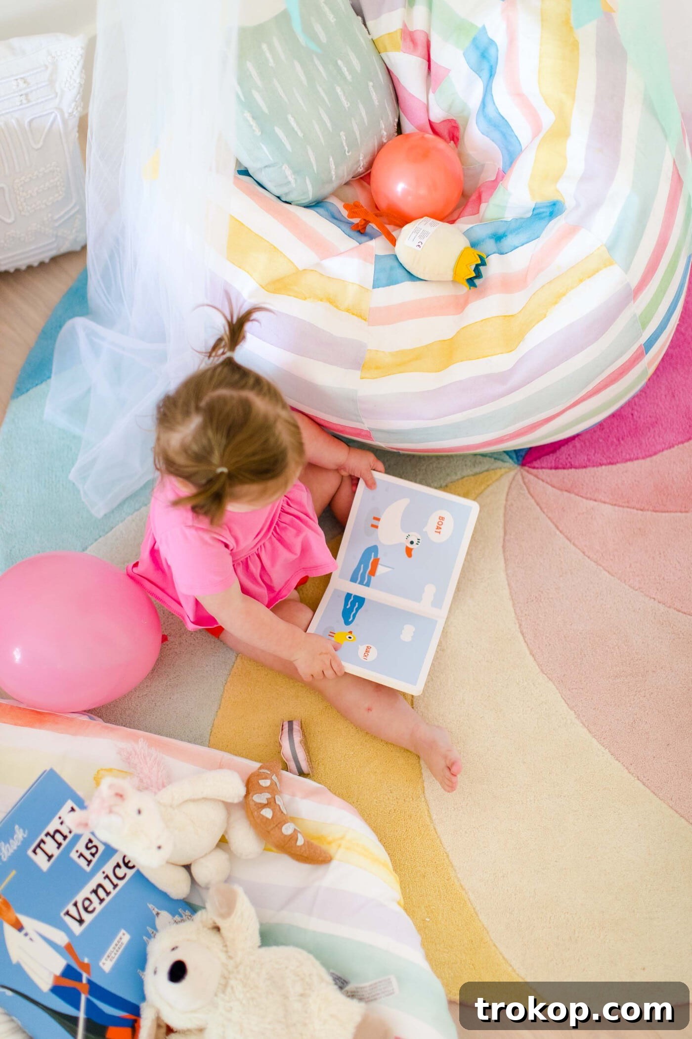 Rainbow Retreats for Little Bookworms 12 Sharing how to make this DIY book nook with a few colorful reading nook ideas to make it own! #decor #kids #diy #reading by top Houston lifestyle blogger Ashley Rose of Sugar & Cloth