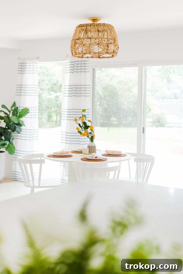Woven Basket Pendant Light 4 A wider shot of the breakfast nook and kitchen, featuring the DIY basket pendant light as a central design element.