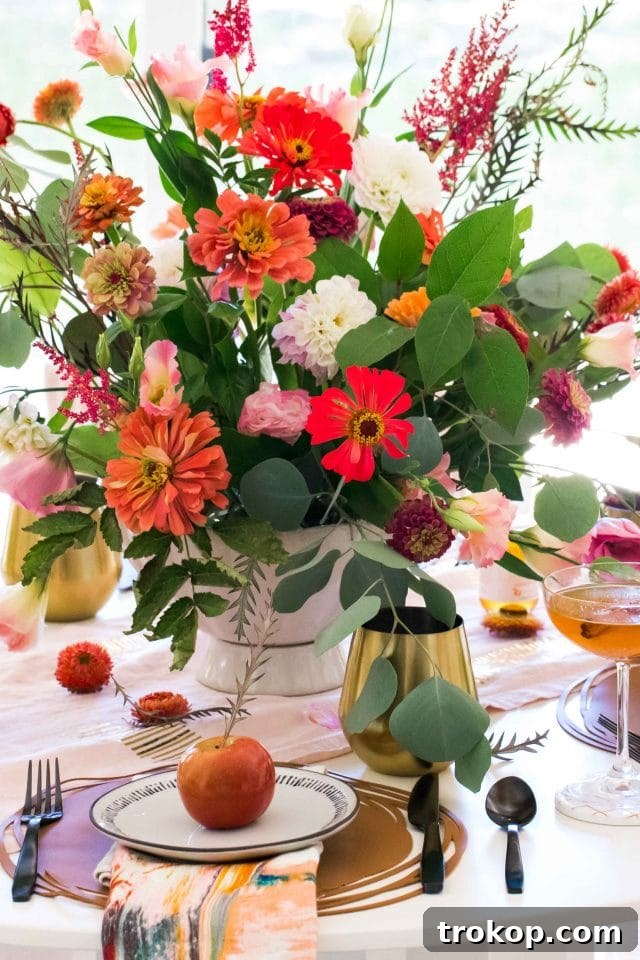 picture of a beautifully arranged fall dining table centerpiece by sugar and cloth