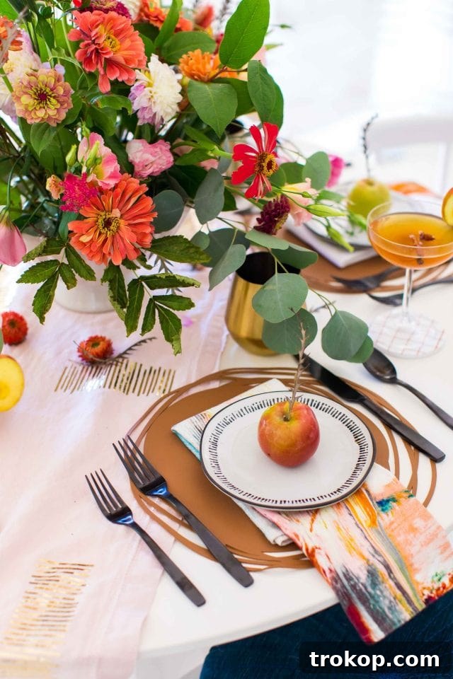 picture of a fall flower arrangement at a place setting by sugar and cloth