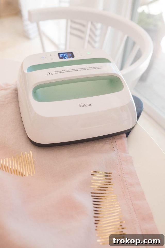 Create a Custom Iron-On Table Runner 4 Step-by-step guide illustrating the use of the Cricut EasyPress for applying iron-on designs to a DIY table runner.