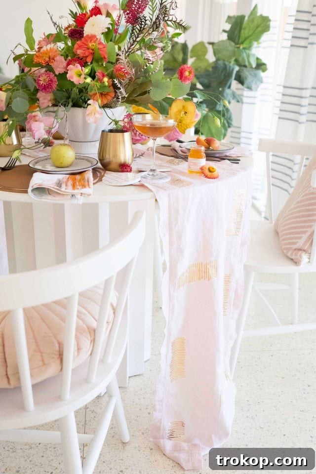 Create a Custom Iron-On Table Runner 8 A beautifully styled dinner table featuring the custom DIY iron-on table runner as its centerpiece.