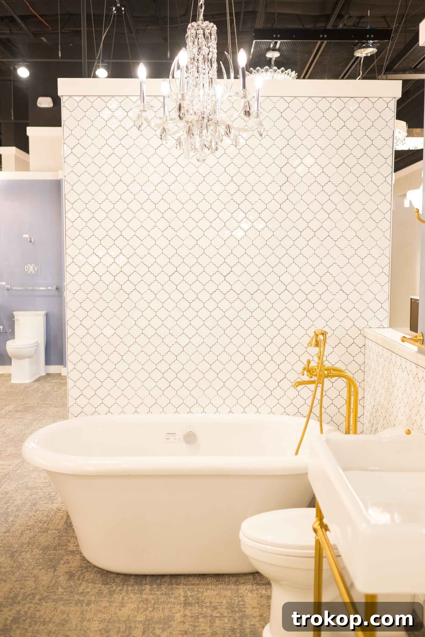 Photo of an elegant freestanding acrylic bathtub with a jet system, showcased at Ferguson Showrooms, inspiring modern master bathroom designs by Sugar & Cloth.