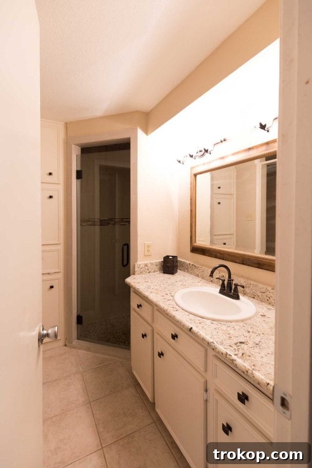 Lakeside Guest Bathroom Makeover: Design Ideas and Pre-Renovation Photos 3 Before photo of the guest bathroom, showing its outdated design elements