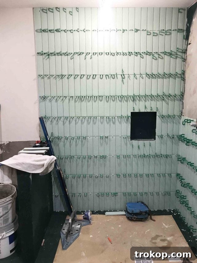 Photo of our tile installation process by Sugar & Cloth, showcasing the progress
