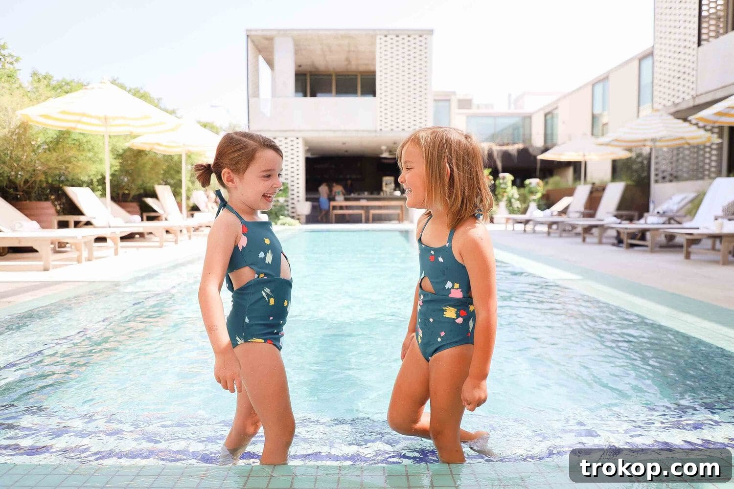 Olivia and friends in Malibu confetti one-pieces by The Ombre Gang