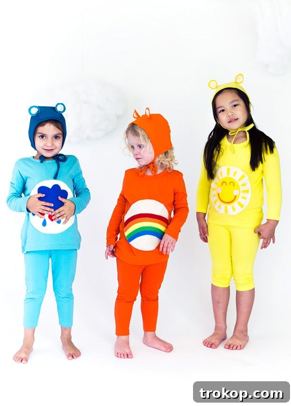 Kids dressed in colorful DIY Care Bears Halloween costumes for a group look