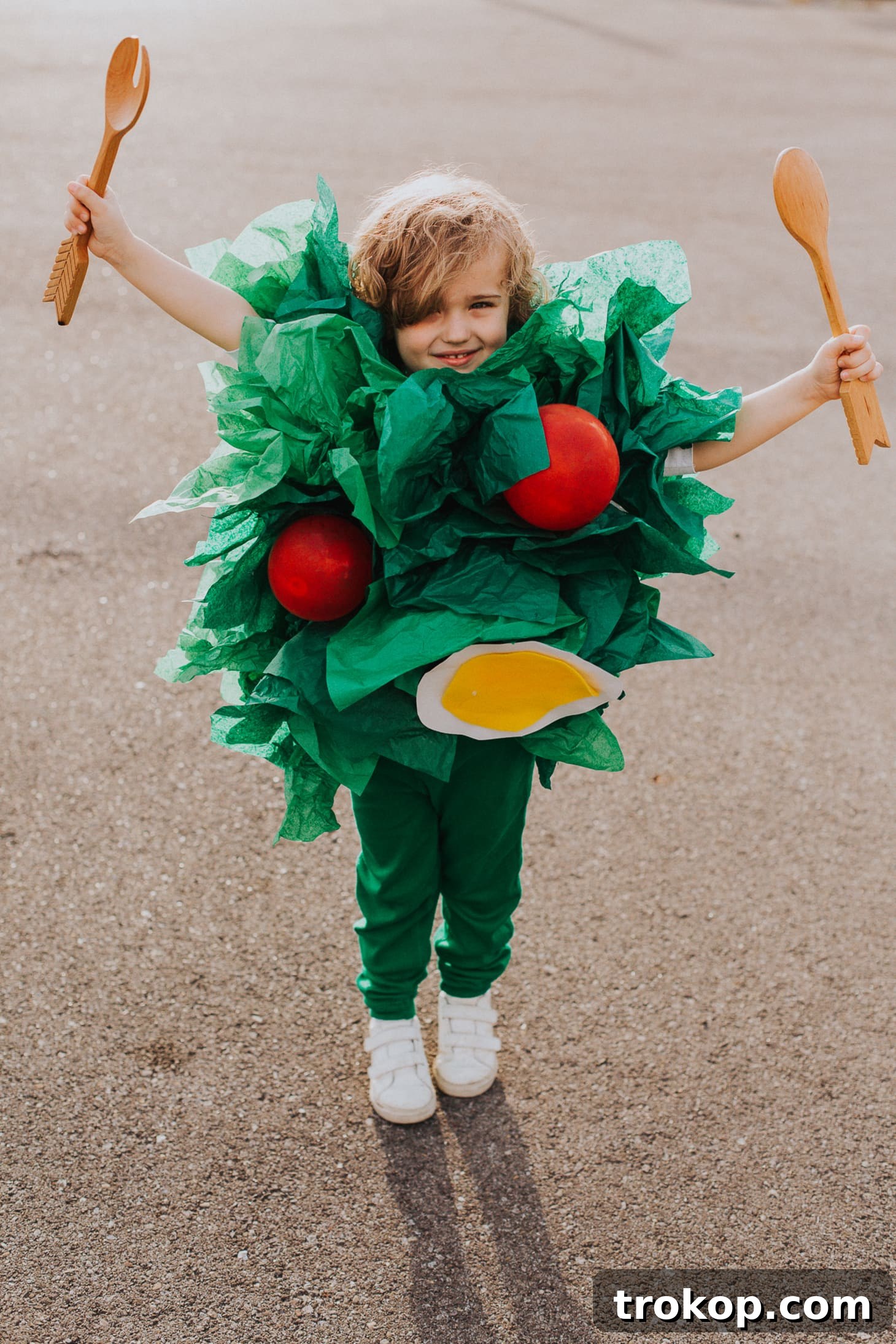 Child dressed in a hilarious DIY Side Salad Halloween costume with leafy greens