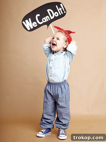 Girl in an inspiring Rosie the Riveter DIY Halloween costume