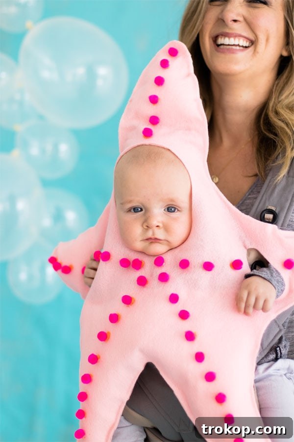 Cute baby in a cozy DIY Starfish Halloween costume in a pastel shade