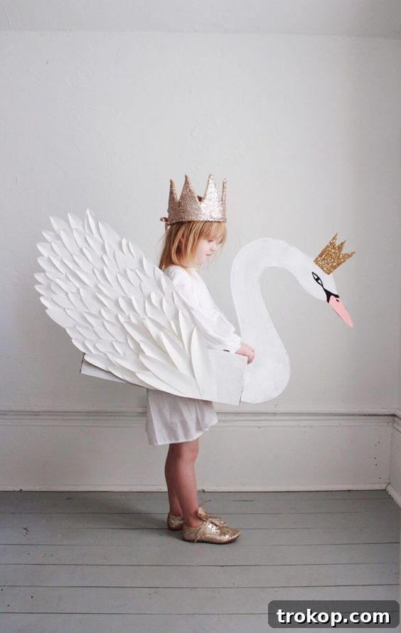 Girl in an elegant DIY Swan Princess Halloween costume with a feathered skirt