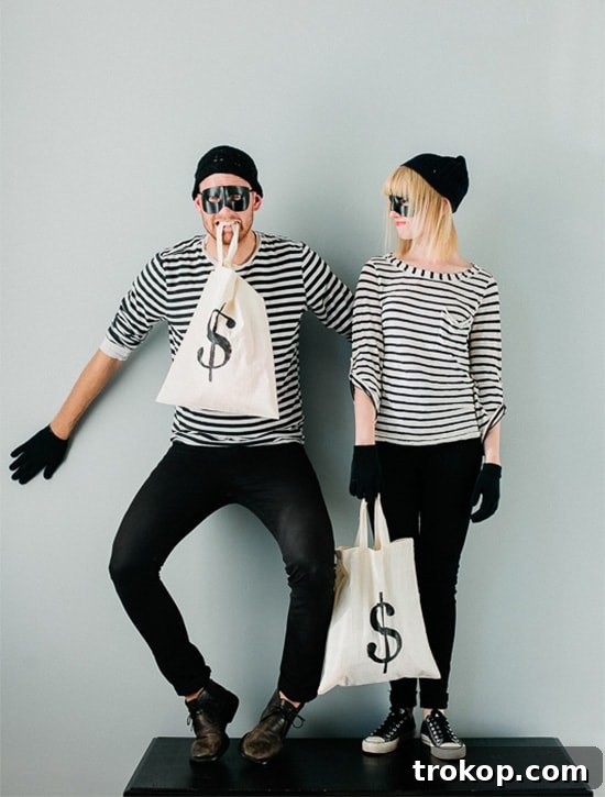 41 Handmade Halloween Costumes for Dynamic Duos 11 Man and woman dressed as burglar bandits for an easy DIY couples Halloween costume.
