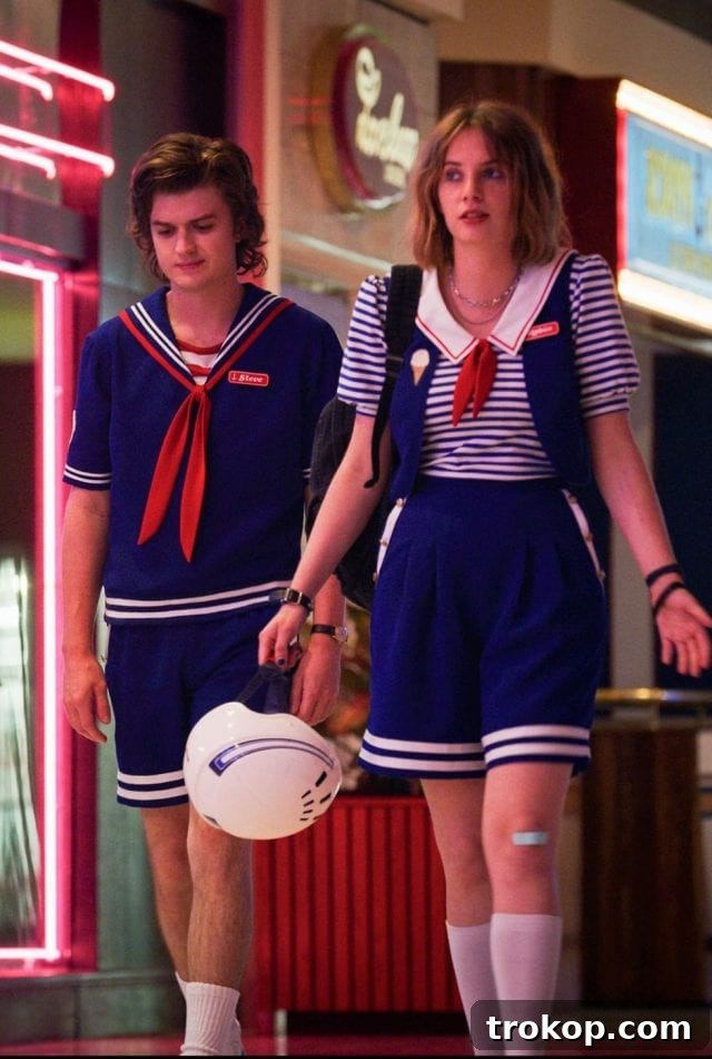 41 Handmade Halloween Costumes for Dynamic Duos 16 Man and woman dressed as Steve Harrington and Robin Buckley from Stranger Things for a couples costume idea.