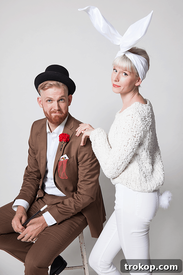 41 Handmade Halloween Costumes for Dynamic Duos 17 Man and woman dressed as a magician and a white rabbit for an easy DIY couples Halloween costume.