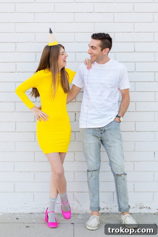 41 Handmade Halloween Costumes for Dynamic Duos 20 Man and woman dressed as a yellow pencil and lined paper for a unique DIY couples costume.