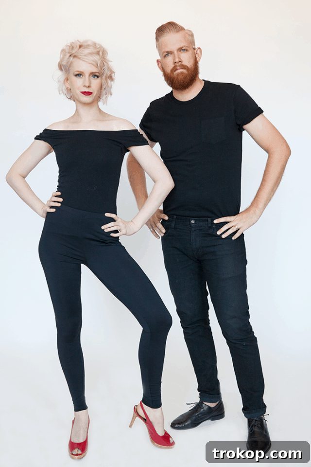 41 Handmade Halloween Costumes for Dynamic Duos 26 Man and woman dressed as Danny Zuko and Sandy Olsson from Grease for a DIY couples costume.
