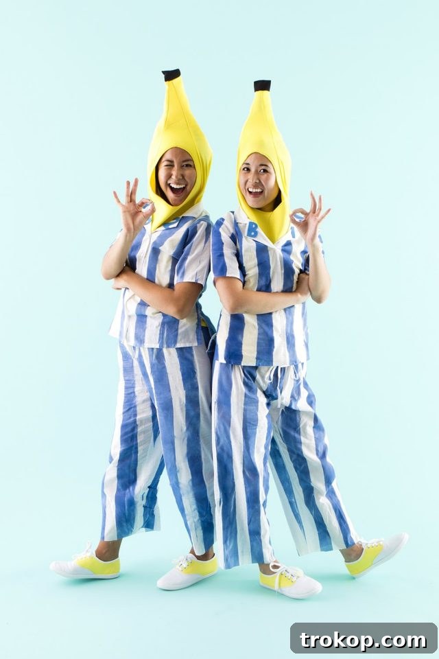41 Handmade Halloween Costumes for Dynamic Duos 28 Two women dressed as Bananas in Pyjamas for a goofy DIY couples costume.