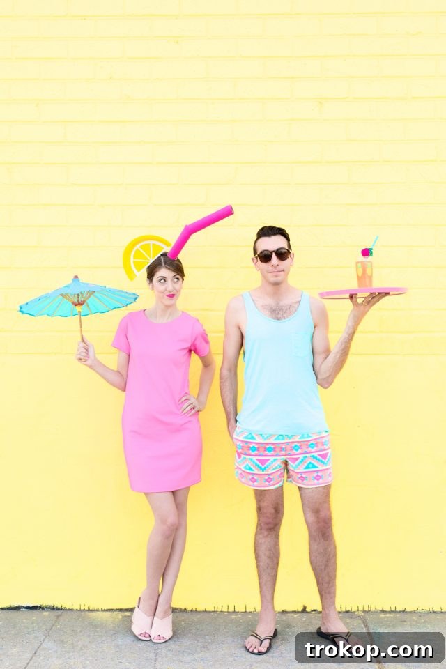 41 Handmade Halloween Costumes for Dynamic Duos 31 Man and woman dressed as a tropical drink and a pool boy for a fun DIY couples costume.
