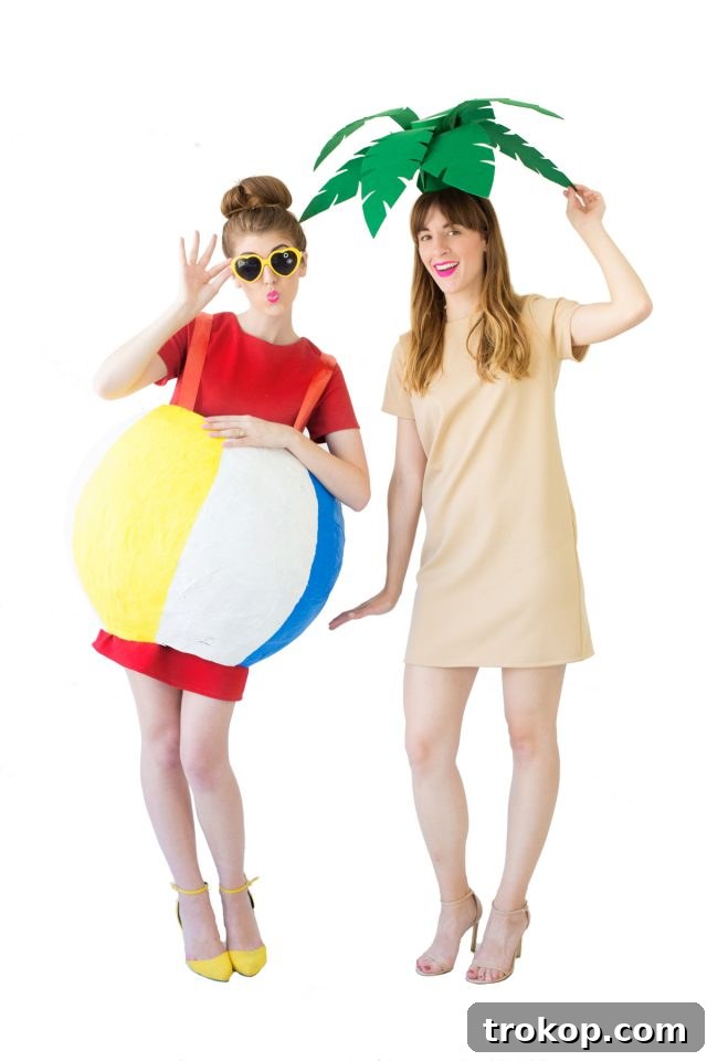 41 Handmade Halloween Costumes for Dynamic Duos 39 Two women dressed as a palm tree and a beach ball for a summery DIY couples costume.
