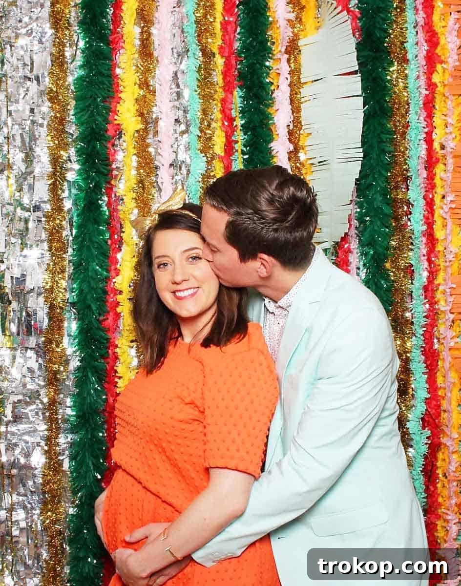 Little Sugar and Cloth's Sweet Second Baby Gender Reveal 2 photo of a couple in a photo booth for gender reveal