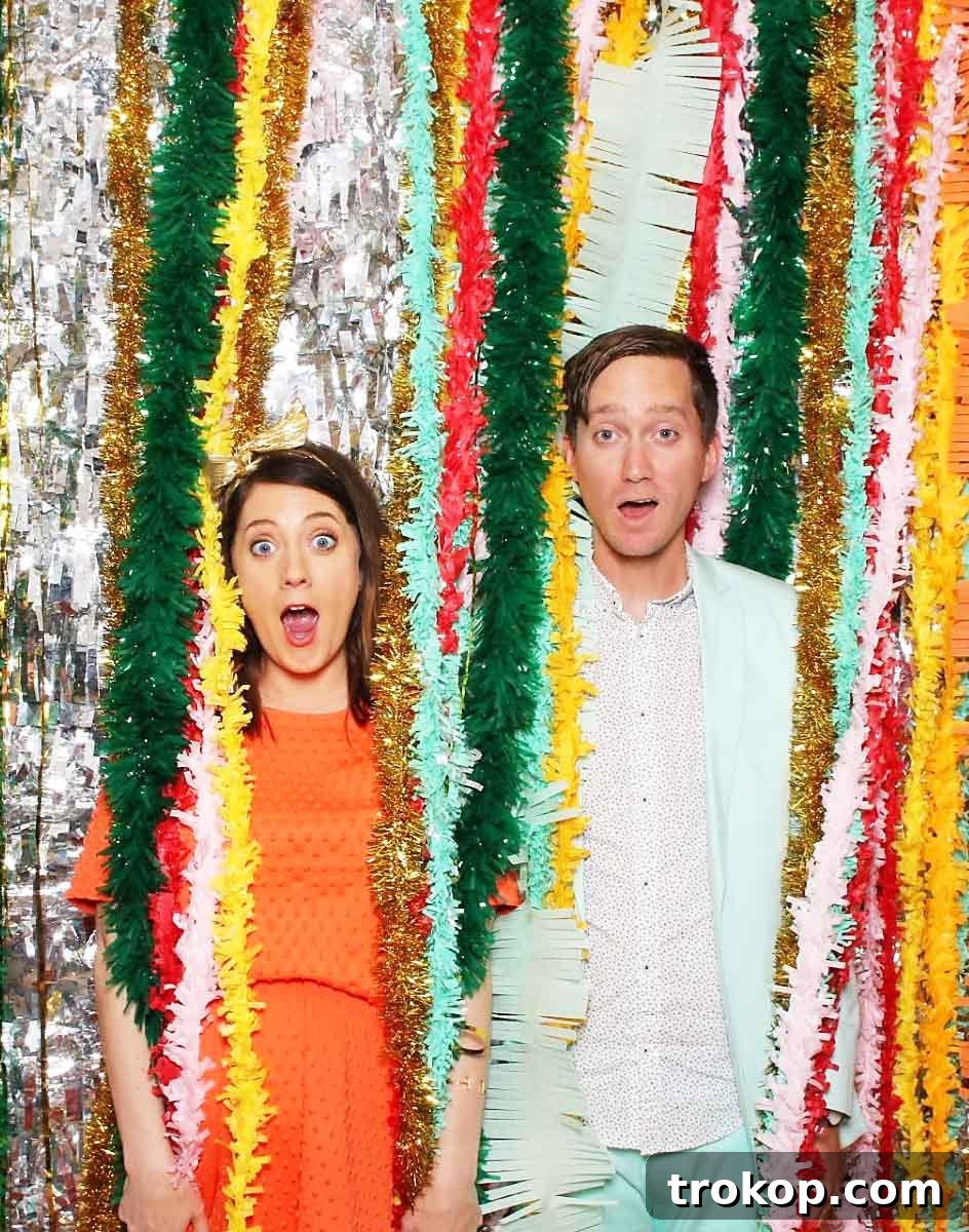 Little Sugar and Cloth's Sweet Second Baby Gender Reveal 3 photo of a couple with streamers in a photo booth