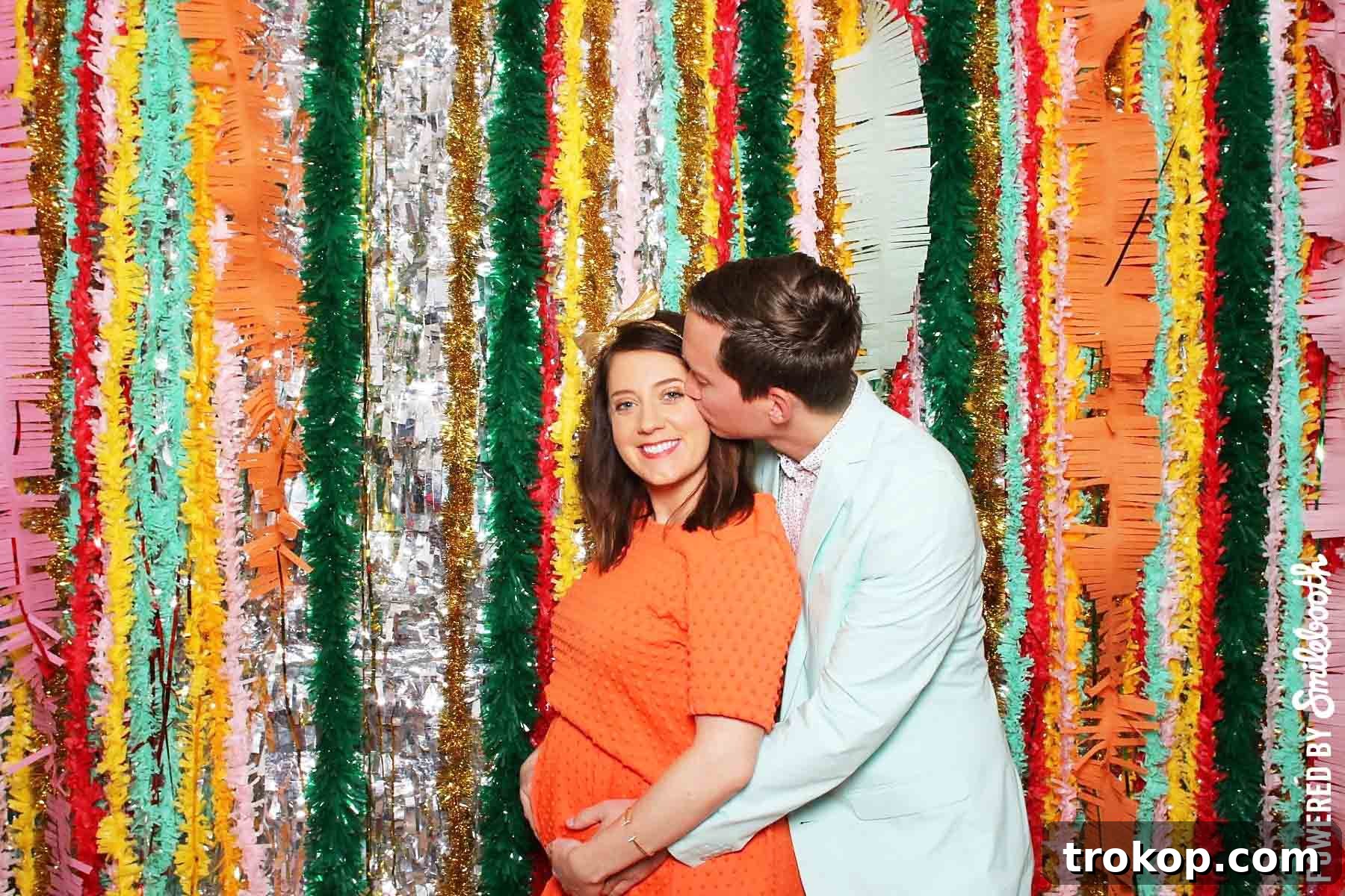 Little Sugar and Cloth's Sweet Second Baby Gender Reveal 7 horizontal photo of a couple in a photobooth