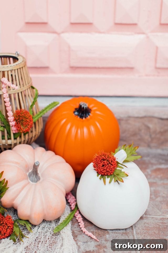 Whimsical Halloween Door Decorating Ideas 3 A collection of peach, orange, and blush pink colorful pumpkins for Halloween decor