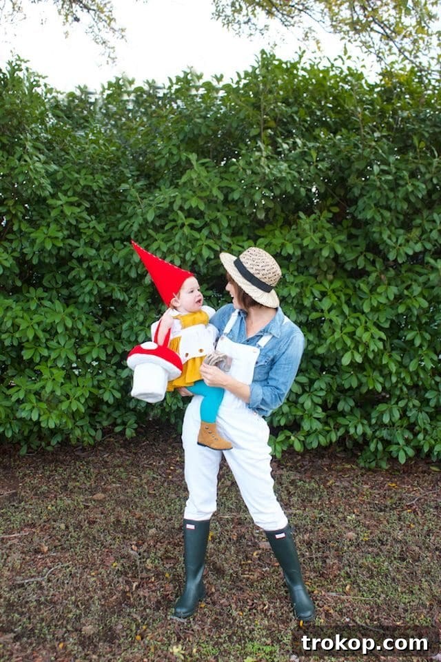 40 Spooktacular Family Halloween Costume Ideas 17 A mother dressed as a gardener and her toddler as an adorable DIY garden gnome Halloween costume, complete with a pointy red hat.