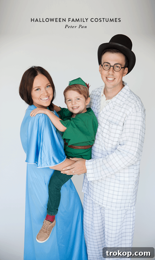40 Spooktacular Family Halloween Costume Ideas 24 Parents and child charmingly dressed as Peter Pan characters for Halloween, including Captain Hook and Tinkerbell.