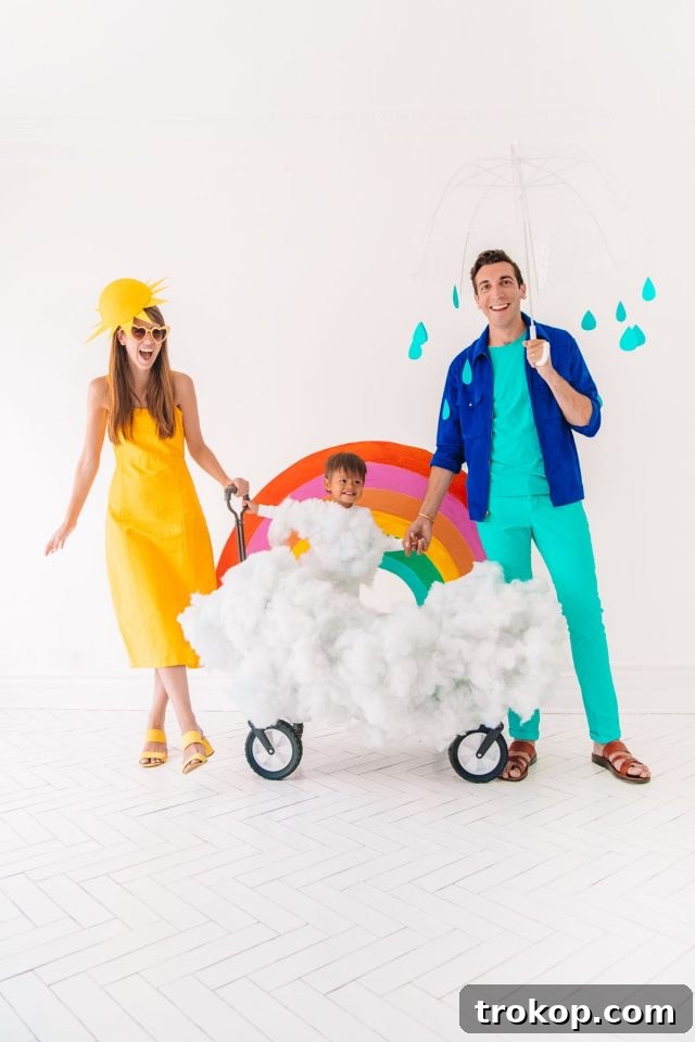 40 Spooktacular Family Halloween Costume Ideas 32 A family dressed in creative DIY weather-themed Halloween costumes, featuring a sun, a rainbow, and a rain cloud.