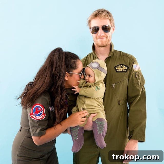 40 Spooktacular Family Halloween Costume Ideas 35 Parents and baby dressed in cool 'Top Gun' themed Halloween costumes, complete with aviators and flight suits.