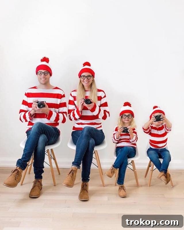 40 Spooktacular Family Halloween Costume Ideas 38 Parents and two children dressed in matching 'Where's Waldo?' costumes for Halloween, featuring red and white stripes.