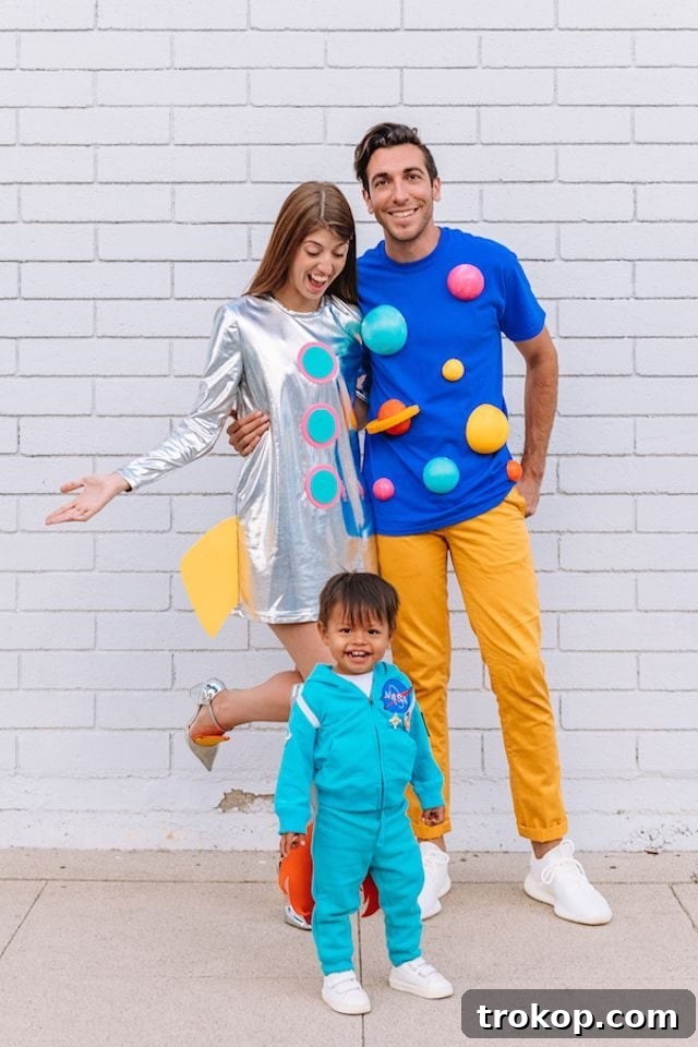40 Spooktacular Family Halloween Costume Ideas 40 A family in imaginative DIY outer space themed costumes: a rocket ship, the universe, and a baby astronaut.
