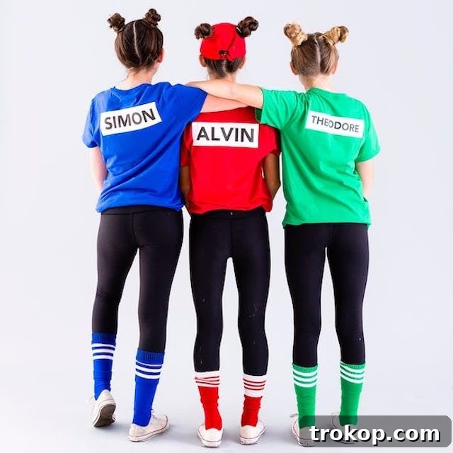 40 Spooktacular Family Halloween Costume Ideas 7 Three children cheerfully dressed as Alvin and the Chipmunks in sporty, DIY Halloween costumes.