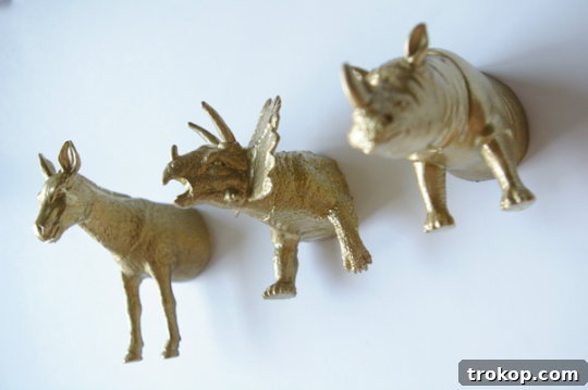 Finished DIY plastic animal magnets on a fridge