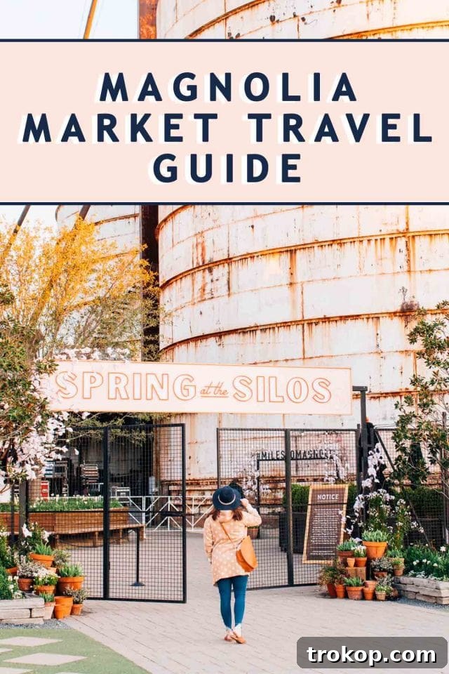 The iconic silos at Magnolia Market stand tall against a clear sky, welcoming visitors to Waco, Texas