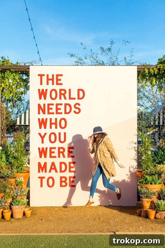 Visitors capture memorable photos in front of the iconic Magnolia Silos signage