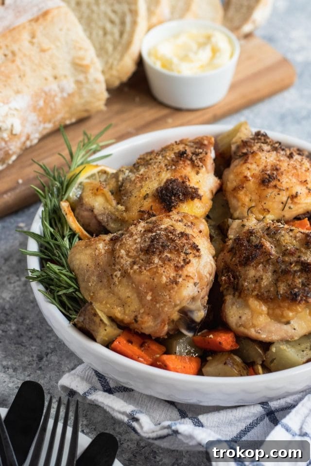 Easy One Pan Lemon Rosemary Chicken 4 Close up photo of a flavorful lemon rosemary chicken dinner in a serving bowl