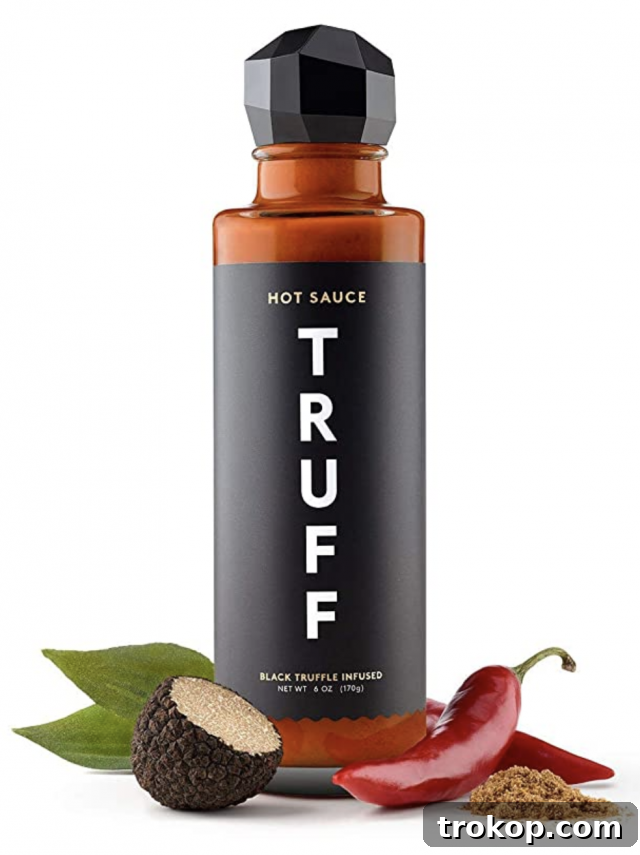 33 Heartfelt Gifts Your Best Friend Deserves 35 Black truffle infused hot sauce bottle with seasonings, a gourmet food gift