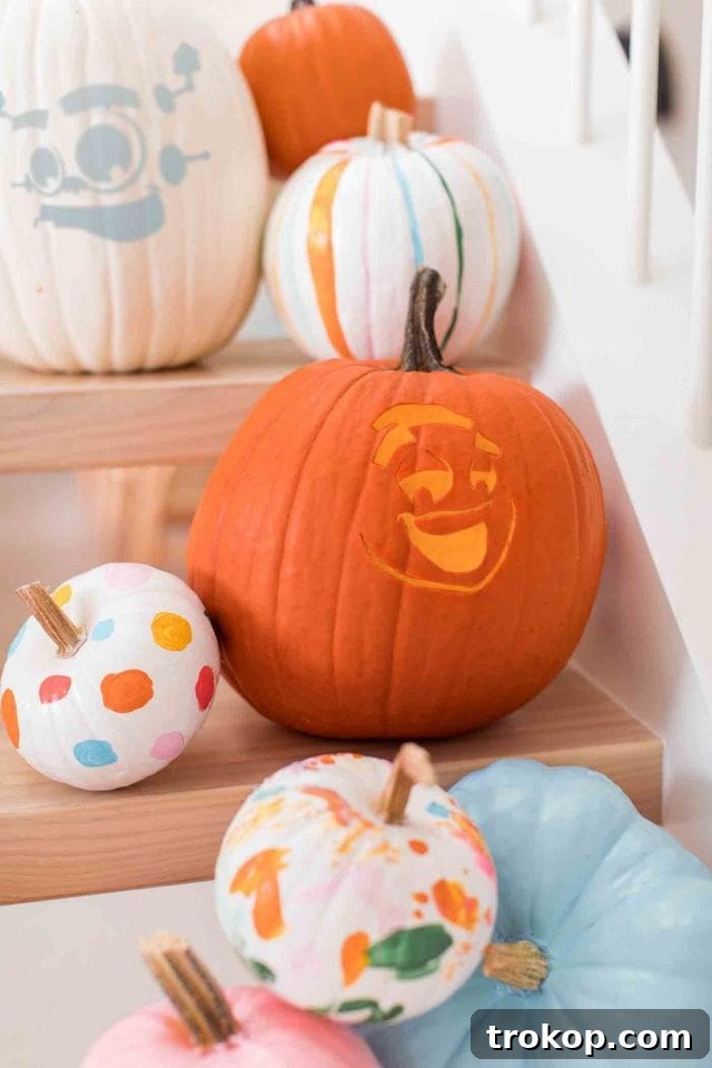 Child playing with a carved pumpkin