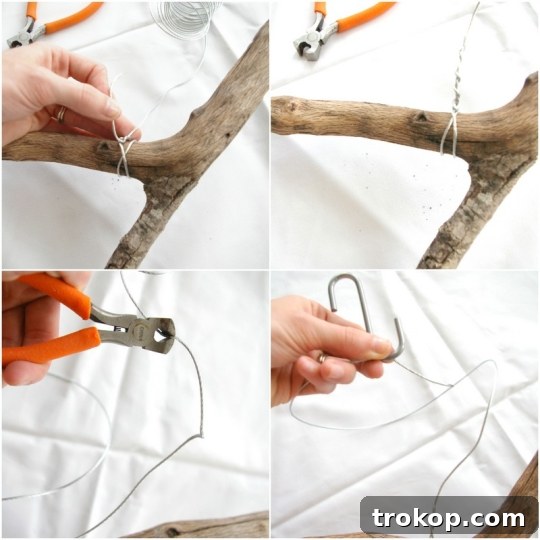 Close-up of a DIY branch clothing rack showing suspended clothes