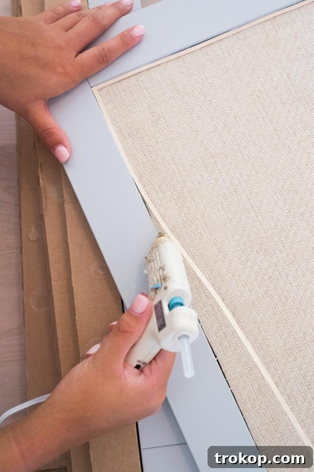 Applying grasscloth to IKEA Besta door for rattan effect