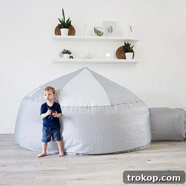 48 Irresistible Toys That Kids Will Love 5 Kids playing in an inflatable air fort, a unique and fun indoor play idea.