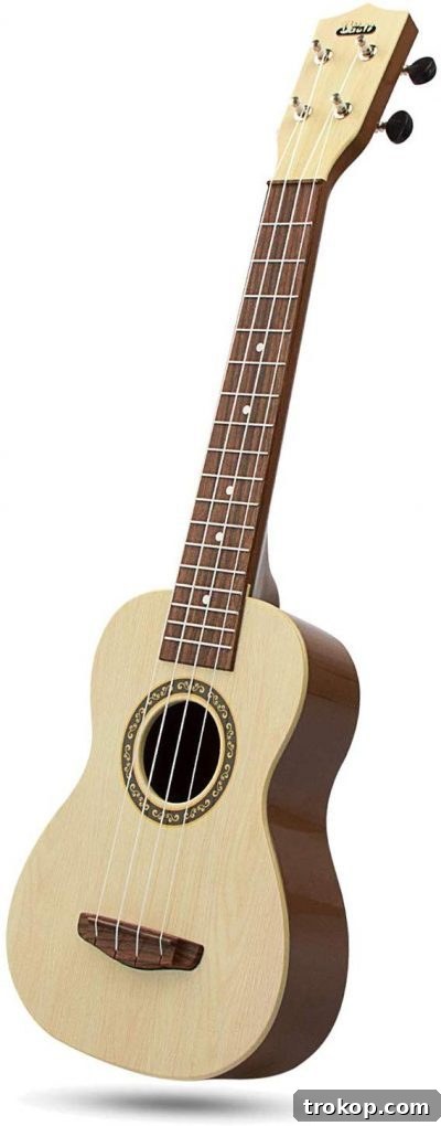 48 Irresistible Toys That Kids Will Love 46 Kids ukulele guitar, a starter musical instrument for fostering music skills.